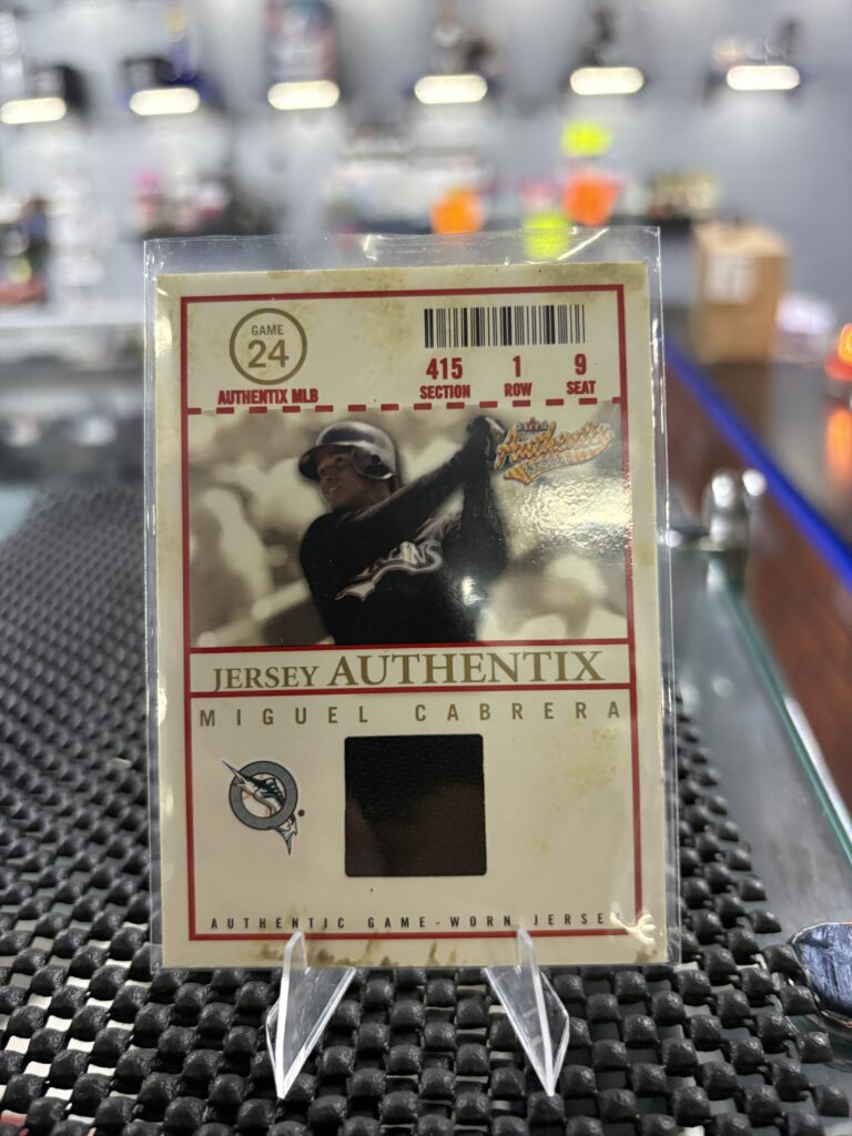 This authentic Miguel Cabrera Fleer Authentix baseball card features a game-worn jersey swatch, making it a highly desirable piece of memorabilia for any dedicated sports card enthusiast.