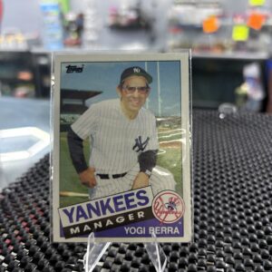 This classic 1985 Topps baseball card featuring legendary New York Yankees manager Yogi Berra is authentic.