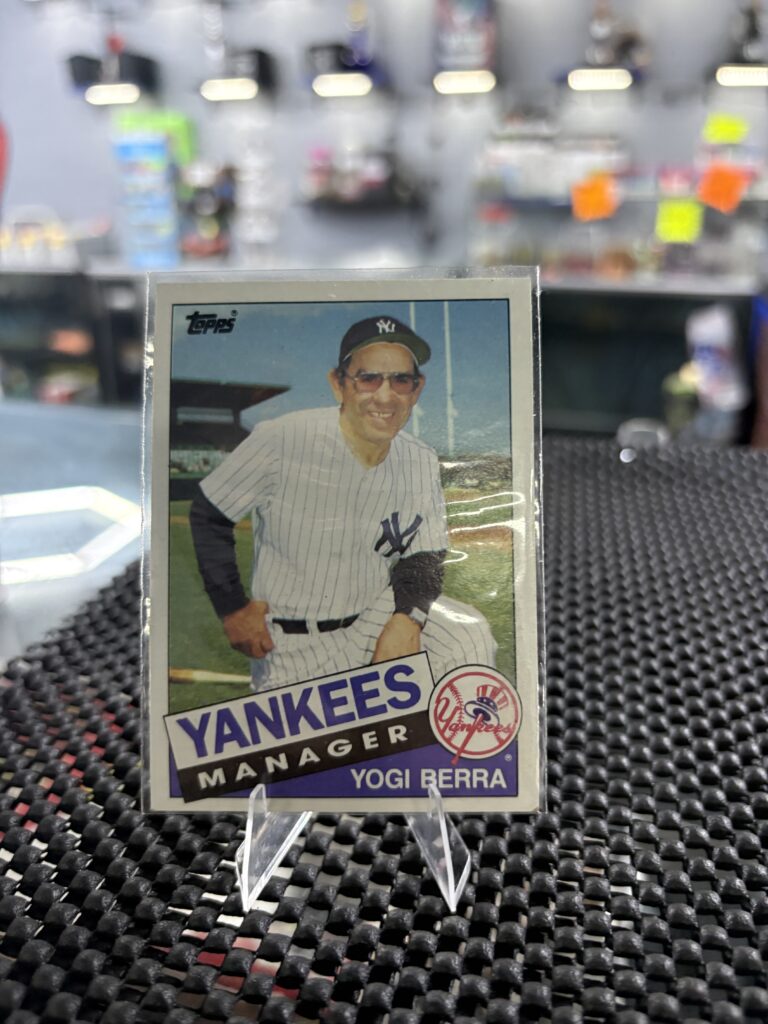 This classic 1985 Topps baseball card featuring legendary New York Yankees manager Yogi Berra is authentic.