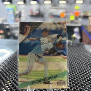 This 1994 rookie baseball card features pitcher Shane Reynolds in action, capturing a great baseball moment.