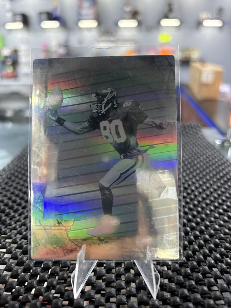 This stunning holographic football card features a wide receiver in motion, making it a prized sports collectible