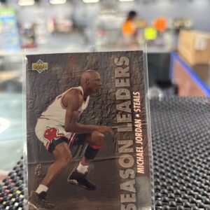 Michael Jordan Upper Deck Season Leaders Steals basketball trading card, Chicago Bulls star in protective sleeve, high quality vintage player collectible in clear display case for serious basketball fans and investors today. (