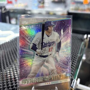 Los Angeles Dodgers Shohei Ohtani Topps Stars of MLB baseball trading card, holographic action shot in protective sleeve, high quality modern star player collectible in clear display case for serious baseball fans and investors today.