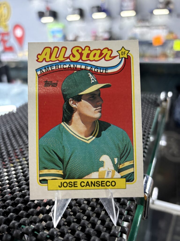 Oakland Athletics Jose Canseco Topps All-Star baseball trading card, classic portrait shot in protective sleeve, high quality vintage rare collectible in clear display case for serious baseball fans and investors today.