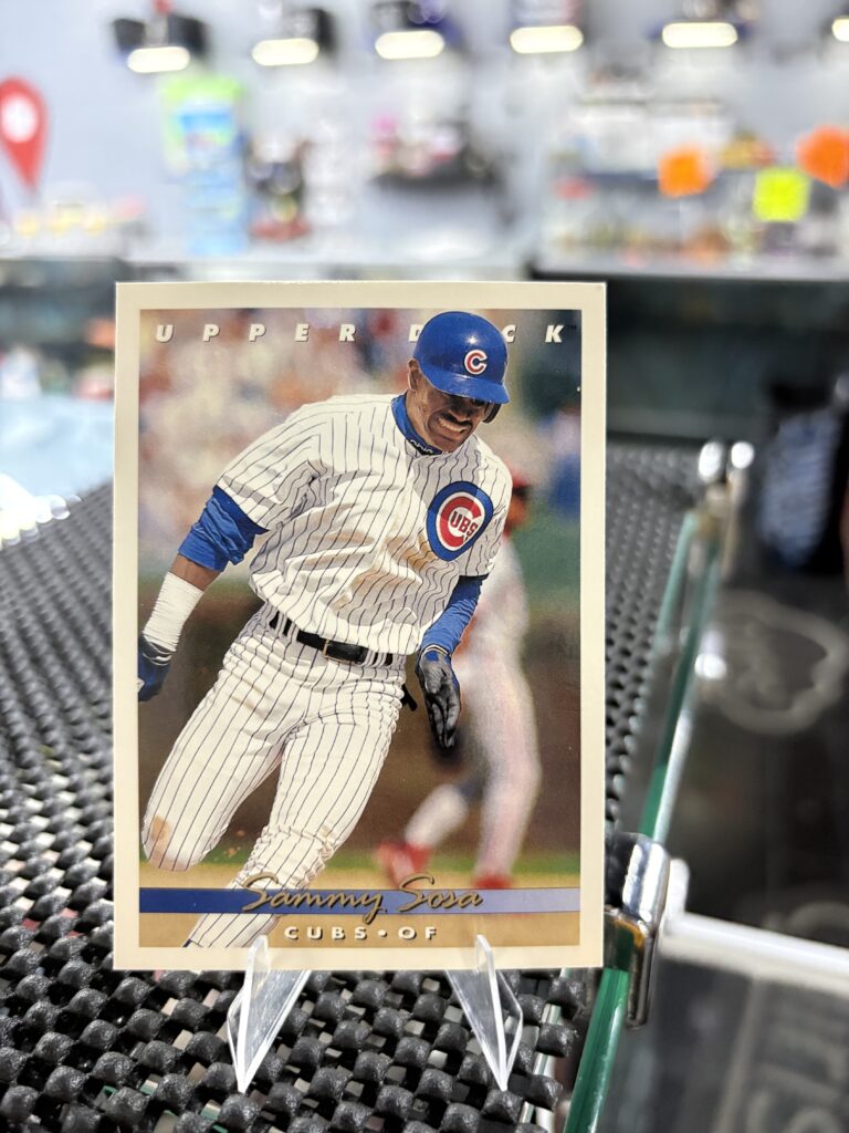 Chicago Cubs Sammy Sosa Upper Deck baseball trading card, base running action shot in protective sleeve, high quality vintage rare collectible in clear display case for serious baseball fans and investors today.