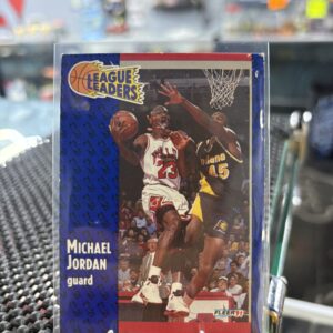 Michael Jordan 1991 Fleer League Leaders basketball trading card, action shot in protective sleeve, high quality vintage guard player collectible in clear display case for serious basketball fans and investors today.