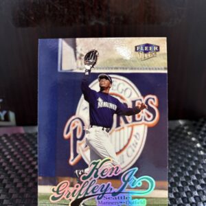 Seattle Mariners Ken Griffey Jr. Fleer Ultra baseball trading card, spectacular defensive catch action shot in protective sleeve, high quality vintage rare collectible in clear display case for serious baseball fans and card investors today.