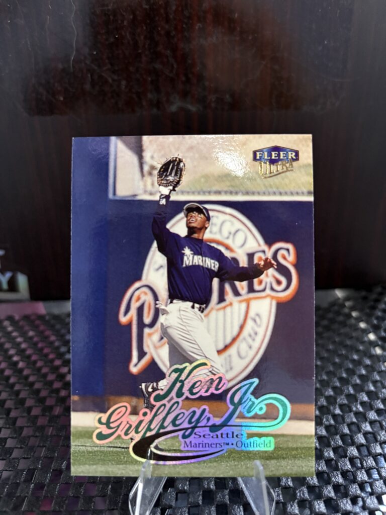 Seattle Mariners Ken Griffey Jr. Fleer Ultra baseball trading card, spectacular defensive catch action shot in protective sleeve, high quality vintage rare collectible in clear display case for serious baseball fans and card investors today.
