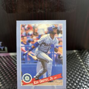 Seattle Mariners Ken Griffey Jr. vintage baseball trading card, base running action shot in protective sleeve, high quality rare collectible in clear display case for serious baseball fans and card investors today.