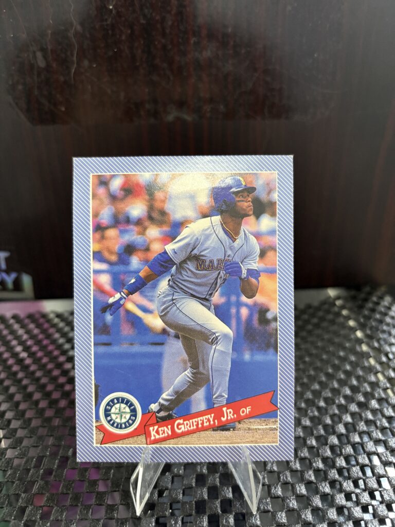 Seattle Mariners Ken Griffey Jr. vintage baseball trading card, base running action shot in protective sleeve, high quality rare collectible in clear display case for serious baseball fans and card investors today.