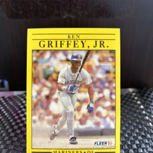Seattle Mariners Ken Griffey Jr. 1991 Fleer baseball trading card, base running action shot in protective sleeve, high quality vintage rare collectible in clear display case for serious baseball fans and card investors today.