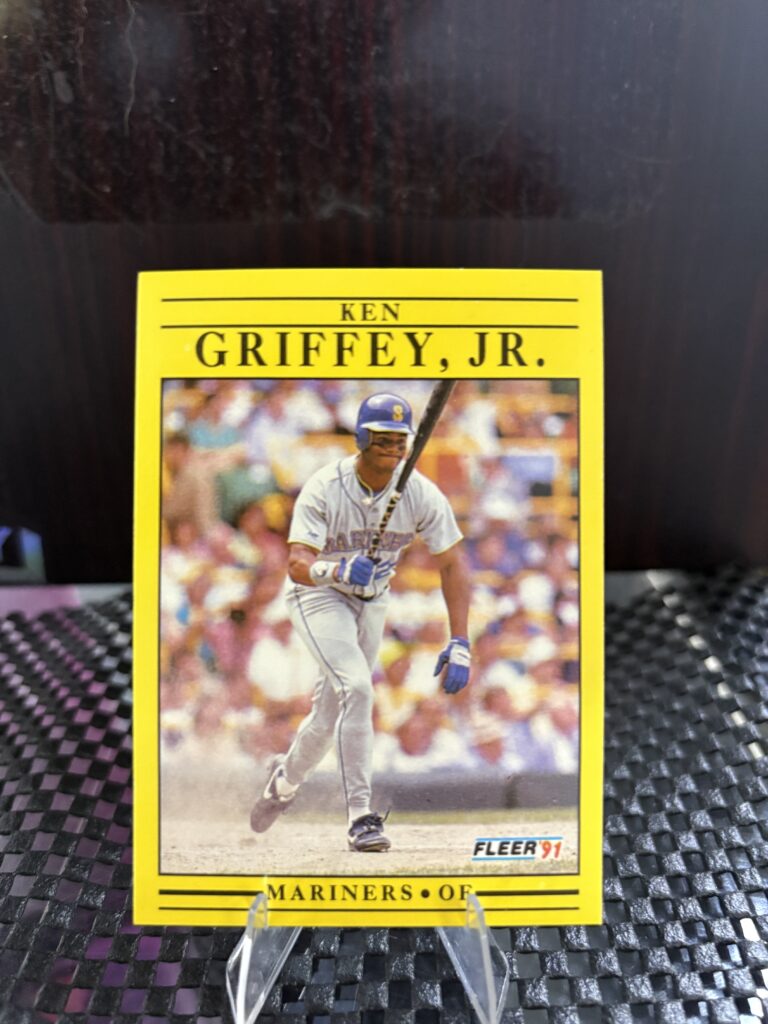 Seattle Mariners Ken Griffey Jr. 1991 Fleer baseball trading card, base running action shot in protective sleeve, high quality vintage rare collectible in clear display case for serious baseball fans and card investors today.