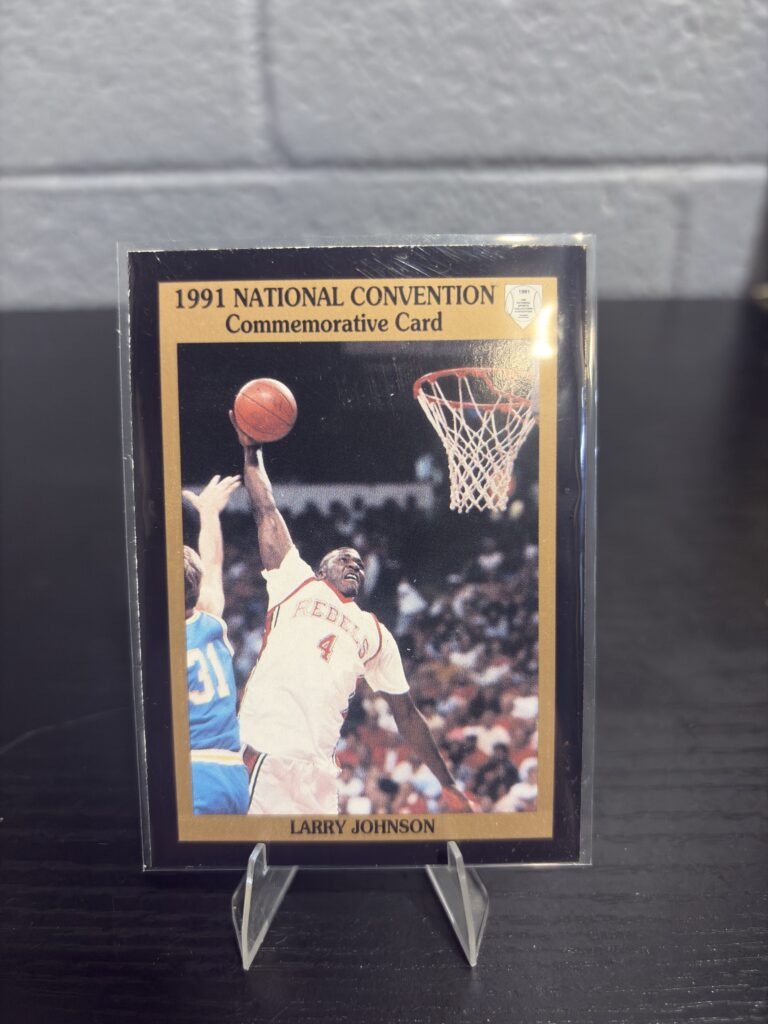 1991 National Convention commemorative Larry Johnson UNLV Rebels basketball trading card, action shot in protective sleeve, high quality rare collectible in clear display case for serious basketball fans and investors today.