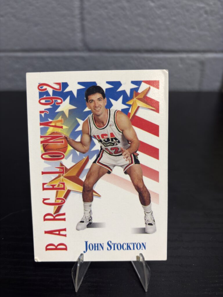 John Stockton 1992 USA Basketball Dream Team trading card, Barcelona Olympic portrait in protective sleeve, high quality vintage rare collectible in clear display case for serious basketball fans and investors today.