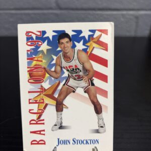 John Stockton 1992 USA Basketball Dream Team trading card, Barcelona Olympic portrait in protective sleeve, high quality vintage rare collectible in clear display case for serious basketball fans and investors today.