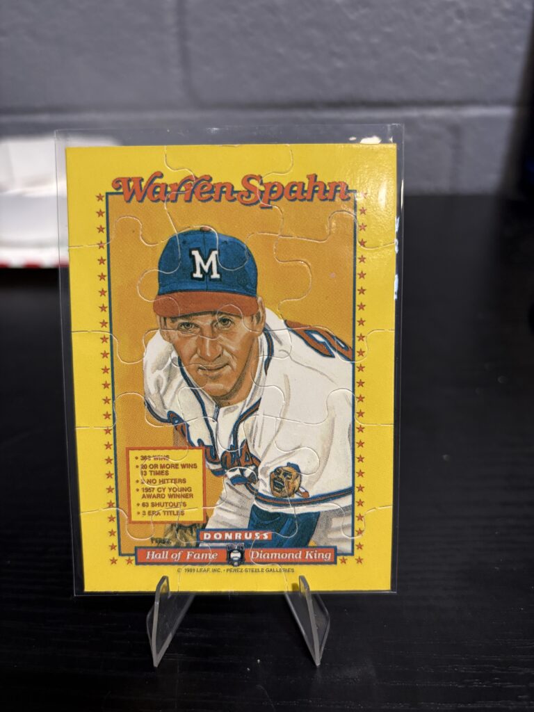 Milwaukee Braves Warren Spahn 1989 Donruss Diamond King puzzle baseball trading card, Hall of Fame vintage portrait in protective sleeve, rare collectible for serious baseball fans and investors in North Las Vegas today.