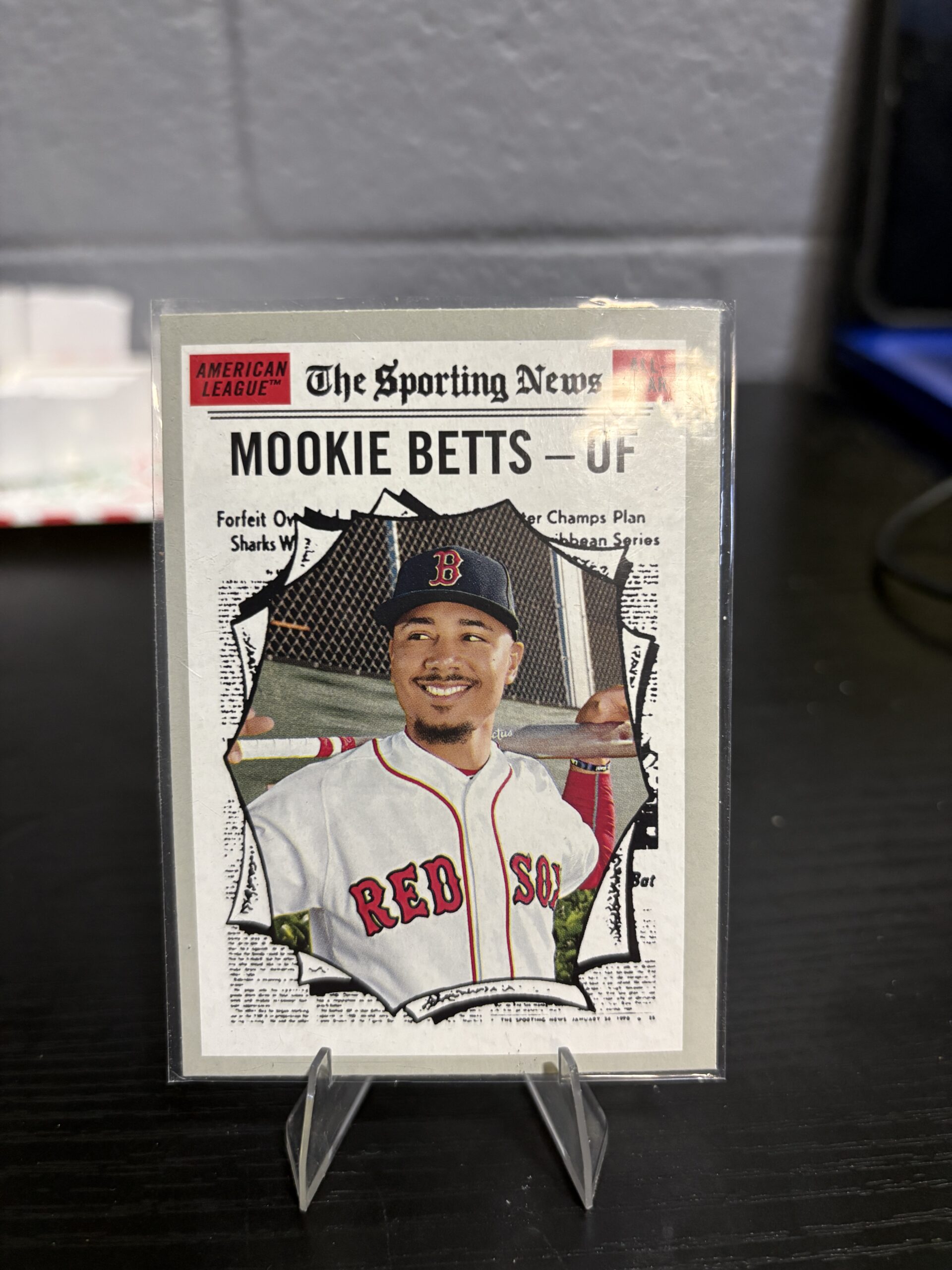 Boston Red Sox Mookie Betts Topps Heritage baseball trading card, Sporting News design in protective sleeve, high quality modern collectible in clear display case for serious baseball fans and card investors today.