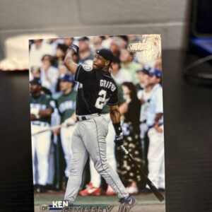 Seattle Mariners Ken Griffey Jr. Topps Stadium Club baseball trading card, powerful swinging action shot in protective sleeve, high quality vintage rare collectible in clear display case for serious baseball fans and investors today.