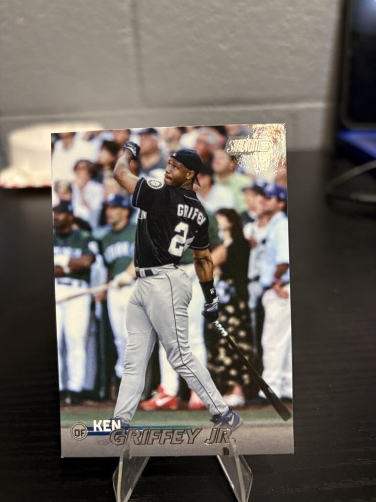 Seattle Mariners Ken Griffey Jr. Topps Stadium Club baseball trading card, powerful swinging action shot in protective sleeve, high quality vintage rare collectible in clear display case for serious baseball fans and investors today.