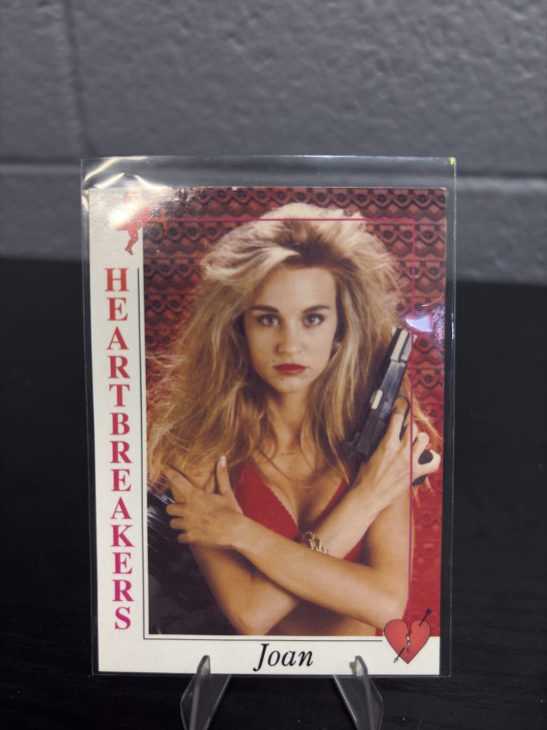 Collectible Heartbreakers trading card featuring Joan, a vintage lifestyle card perfect for enthusiasts looking to expand their unique personal collections and manifest financial growth today.