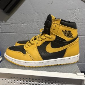 Air Jordan 1 Retro High OG in a black and yellow "Pollen" colorway, a highly sought-after sneaker for collectors looking to add high-value, stylish assets to their portfolio today.