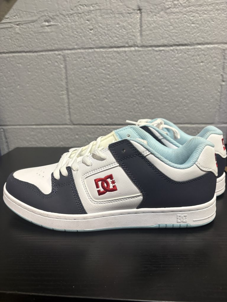 Classic DC Court Graffik skate shoes in a clean white, navy, and red colorway, ideal for collectors and skaters looking to add high-value, durable assets to their collection today.
