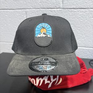 Black "Discover" mountain-themed Trader Bos snapback cap, a stylish and adventure-ready accessory for those building a high-value, unique collection today.