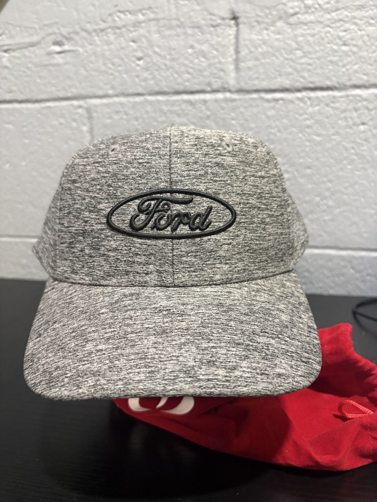 Sleek grey heathered Ford baseball cap with an embroidered logo, a classic and professional accessory for automotive enthusiasts building a high-value, functional collection today.