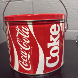 Classic red Coca-Cola "Coke" metal bucket with handle, a perfect retro-style storage or display piece for Coca-Cola collectors looking to add authentic, high-value brand merchandise to their collection today.