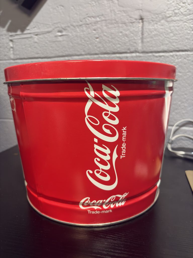 Vintage Coca-Cola branded metal tin, repurposed for "Snack Bonanza," a nostalgic and highly collectible piece for enthusiasts building a unique, high-value asset portfolio today.