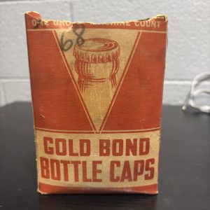 Vintage "Gold Bond" bottle cap box, factory-filled with original cork-lined caps, a rare and authentic industrial collectible perfect for enthusiasts of antique breweriana and home-brewing history.