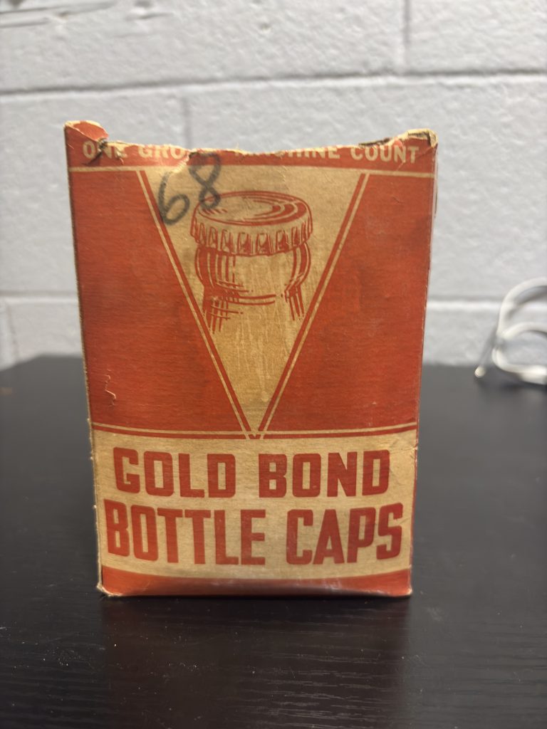 Vintage "Gold Bond" bottle cap box, factory-filled with original cork-lined caps, a rare and authentic industrial collectible perfect for enthusiasts of antique breweriana and home-brewing history.