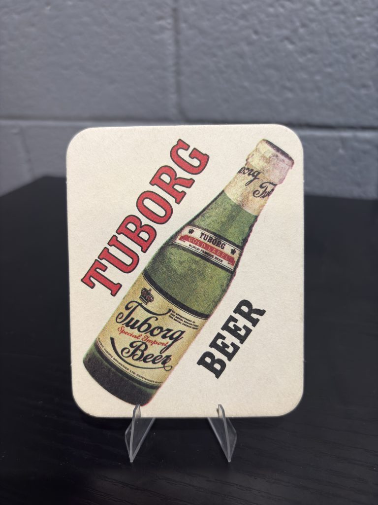 Set of 2 vintage Tuborg Gold Label beer coasters, a high-vibration collectible perfect for breweriana enthusiasts looking to manifest prosperity and add authentic brand history to their portfolio.