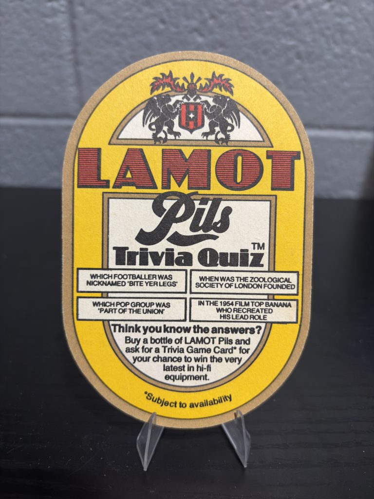 Vintage Lamot Pils "Trivia Quiz" beer coaster featuring a promotional giveaway for Philips Compact Disc Stereo systems, a high-vibration collectible perfect for enthusiasts of international breweriana and vintage electronics history.