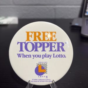Vintage 1990 California Lottery "FREE TOPPER" promotional pinback button, a high-vibration collectible perfect for enthusiasts of gaming and state lottery memorabilia looking to manifest prosperity today