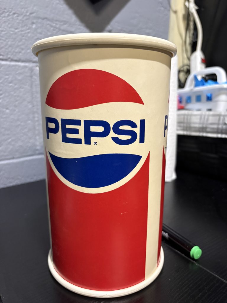 Vintage Pepsi-Cola branded "REUSABLE BANK" promotional coin container, a high-vibration collectible perfect for enthusiasts of vintage soda memorabilia looking to manifest prosperity today.