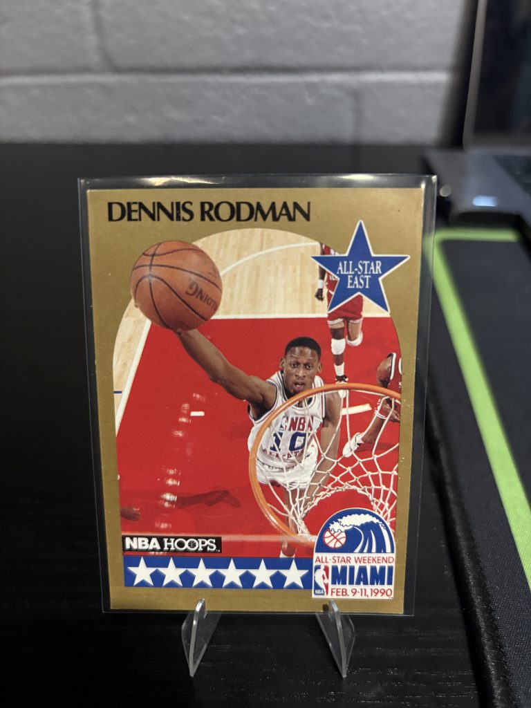 Vintage 1990 NBA Hoops Dennis Rodman "All-Star East" trading card, a master-number 11 frequency collectible for basketball enthusiasts focused on historic excellence and visionary performance.