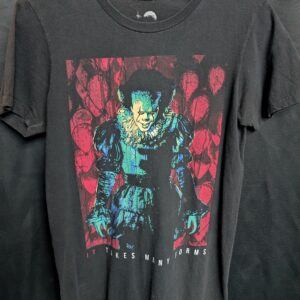 Vintage faded black graphic t-shirt featuring Pennywise from the movie IT with red balloons and the text 'IT TAKES MANY FORMS'.