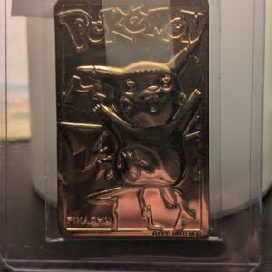 Vintage 1999 Burger King 23K gold-plated Pikachu Pokémon promotional trading card displayed on a black stand.