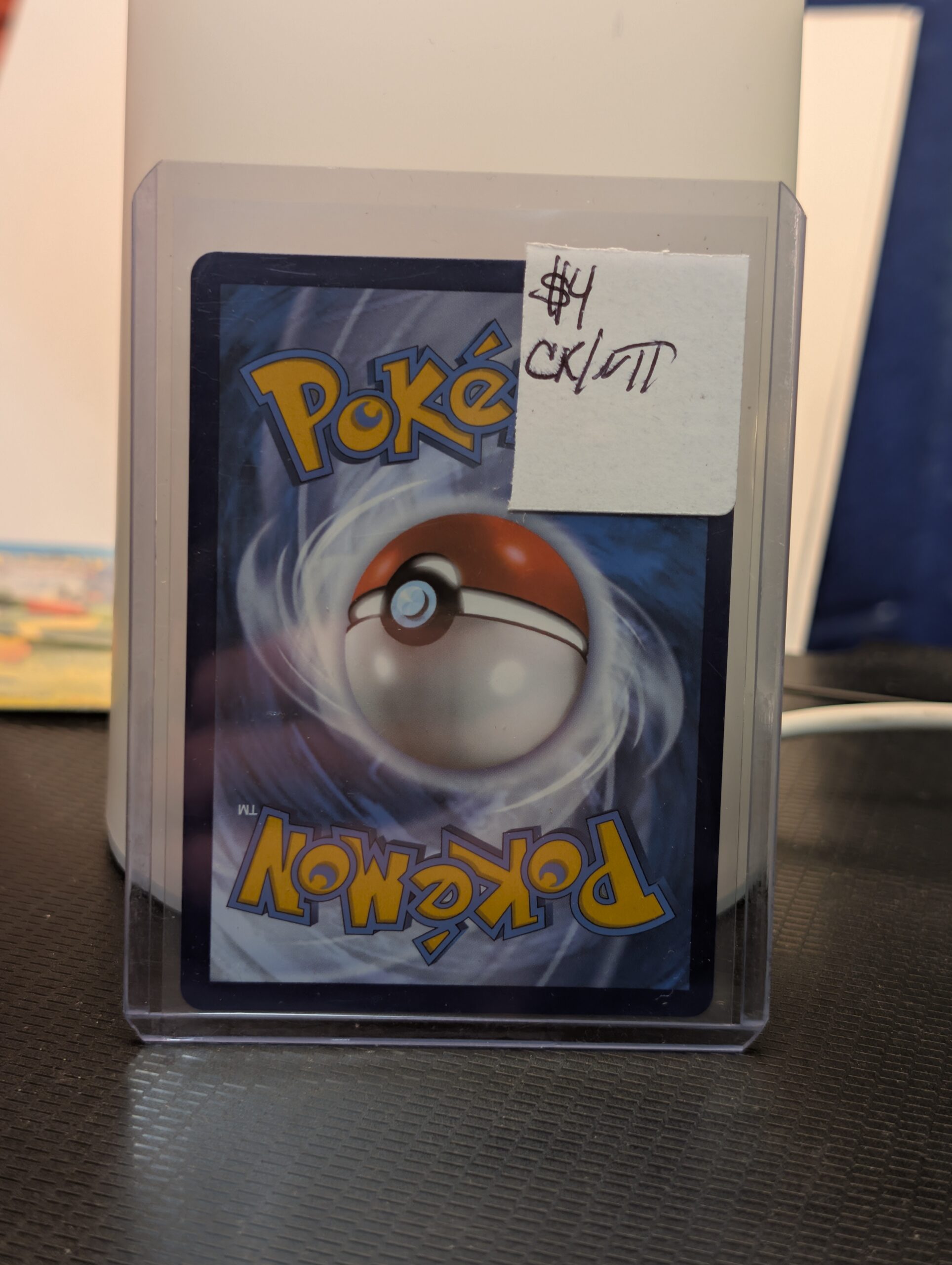 Radiant Alakazam holographic Pokémon trading card, number 059/195 from the Silver Tempest set, displayed in a clear protective plastic sleeve.