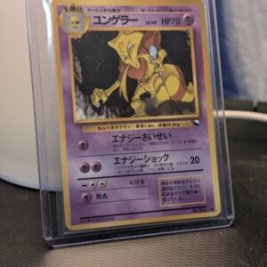 Vintage 1998 Japanese Kadabra Pokémon trading card, number 064 from the Vending Series 3 set, featuring Shin-ichi Yoshida artwork, displayed in a clear protective plastic sleeve.