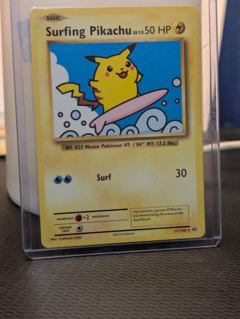 Surfing Pikachu Pokémon trading card, number 111/108 from the 2016 XY Evolutions expansion set, displayed in a clear protective plastic sleeve.
