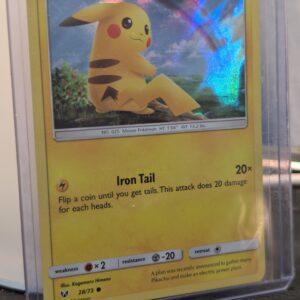 Holographic Pikachu Pokémon trading card, number 28/73 from the 2017 Shining Legends expansion, featuring the exclusive Cosmos holofoil pattern, displayed in a clear protective plastic sleeve.