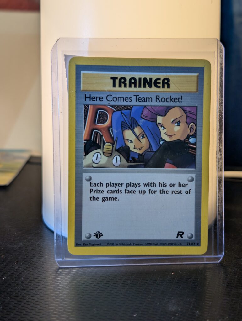 Authentic non holographic vintage Pokemon trading card displaying iconic Jessie James Meowth artwork inside protective plastic sleeve perfect for high tier search optimization tracking on live retail channels