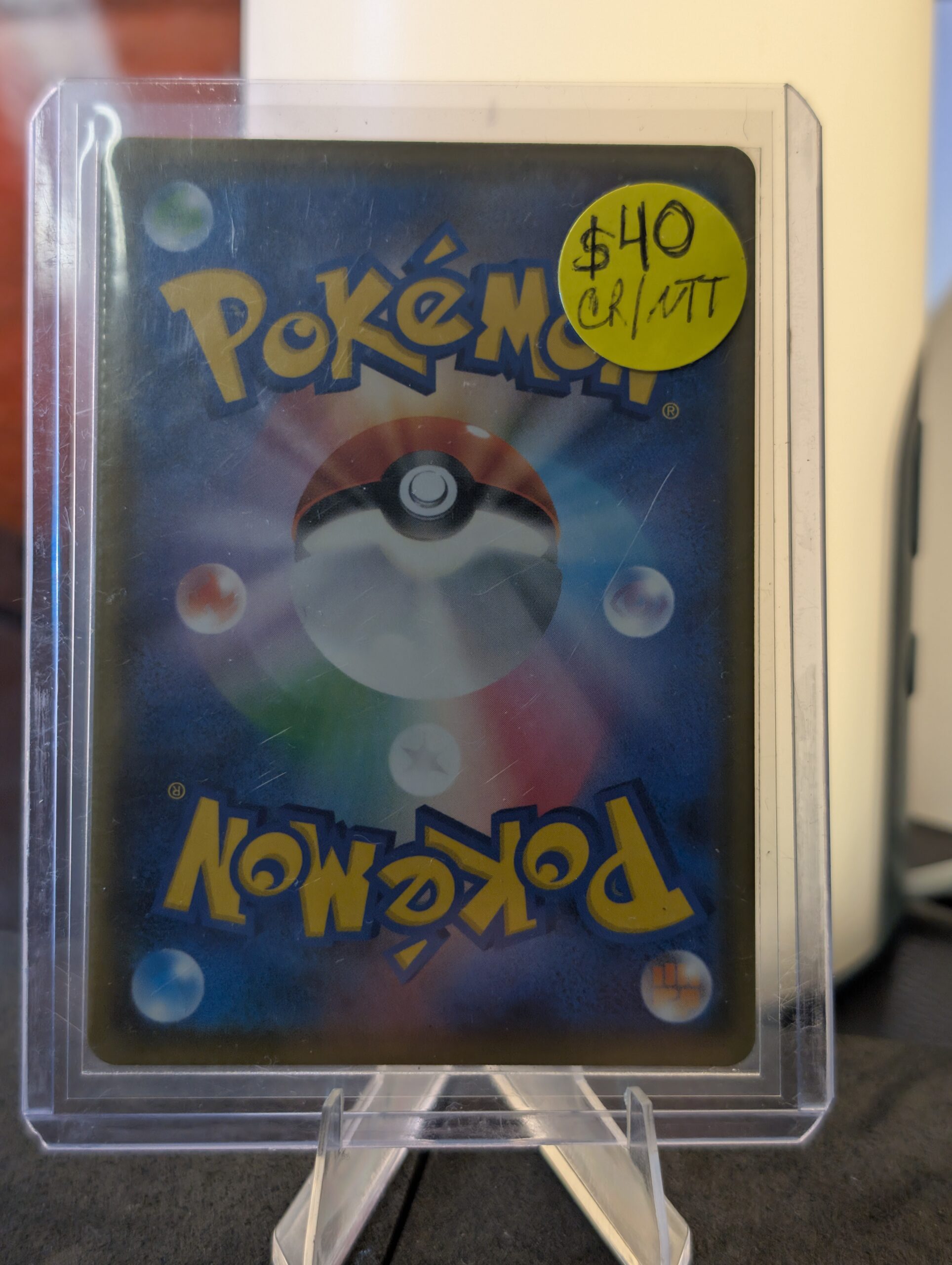 Stunning authentic Team Rocket Meowth illustration rare holographic modern trading card from Destined Rivals expansion safely displayed inside clear protective plastic sleeve for premium retail collection upgrades today.