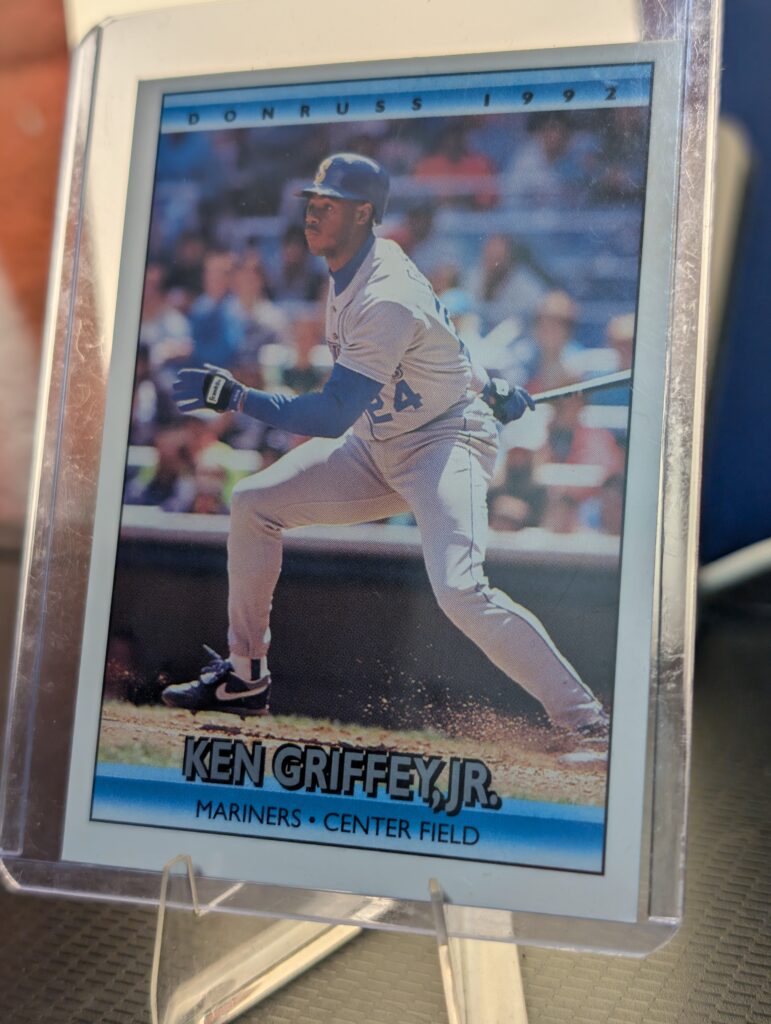 Authentic 1992 Donruss Ken Griffey Jr Seattle Mariners vintage baseball card displaying classic batting stance inside a clear protective plastic sleeve perfectly capturing ultimate sports history.