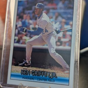 Authentic 1992 Donruss Ken Griffey Jr Seattle Mariners vintage baseball card displaying classic batting stance inside a clear protective plastic sleeve perfectly capturing ultimate sports history.
