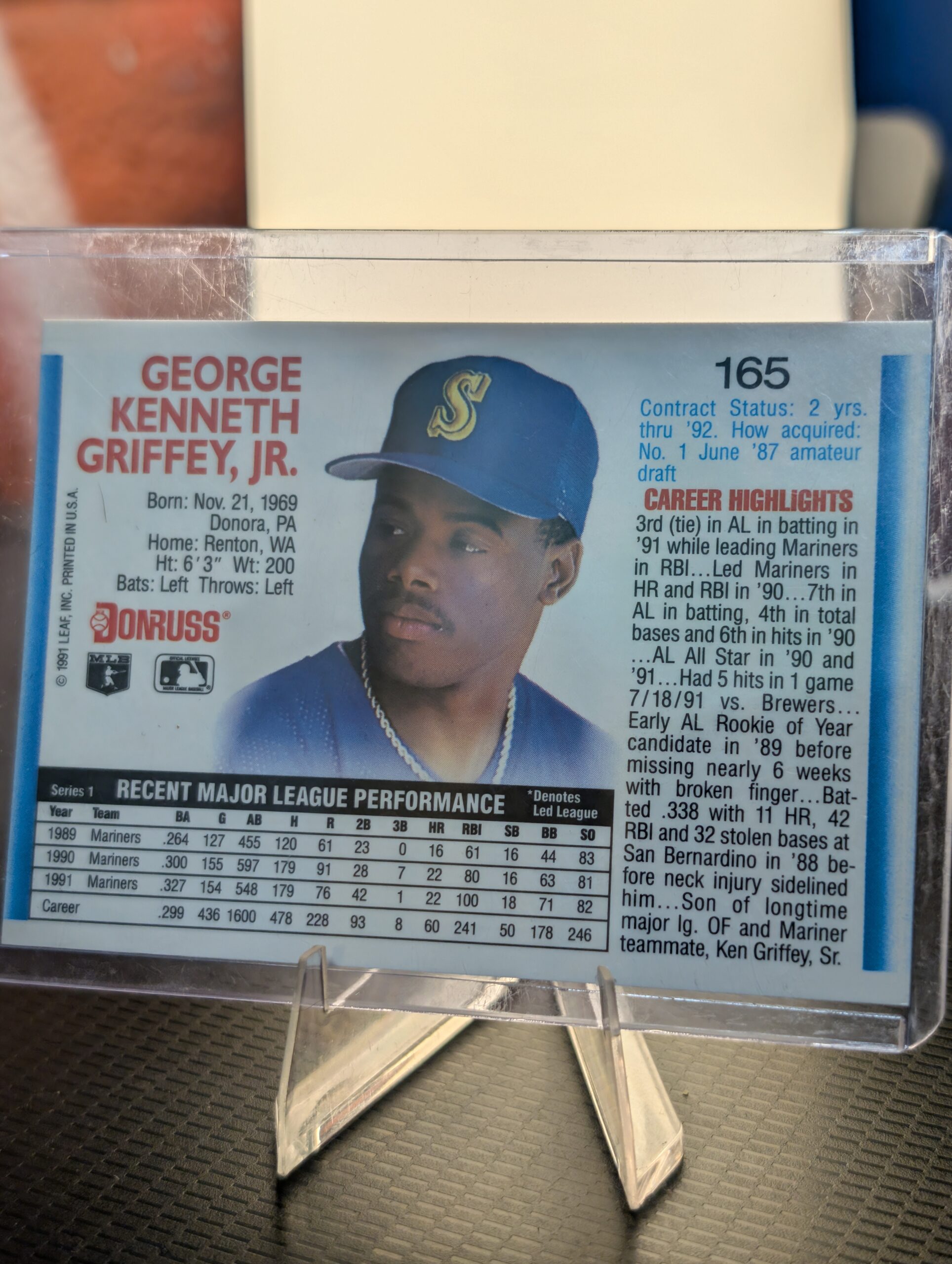 Authentic 1992 Donruss Ken Griffey Jr Seattle Mariners vintage baseball card displaying classic batting stance inside a clear protective plastic sleeve perfectly capturing ultimate sports history.