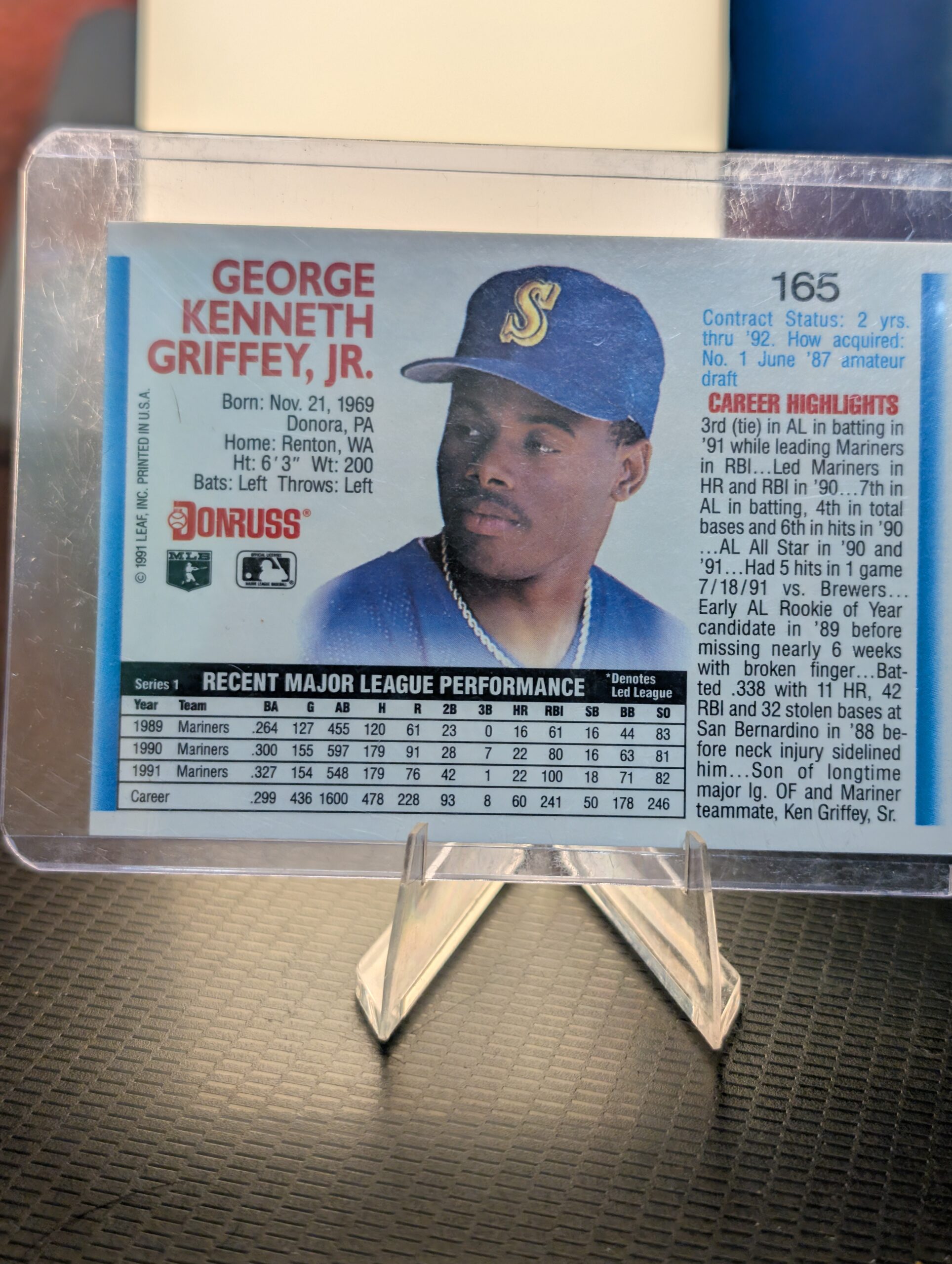 Authentic 1992 Donruss Ken Griffey Jr Seattle Mariners vintage baseball card displaying classic batting stance inside a clear protective plastic sleeve perfectly capturing ultimate sports history.