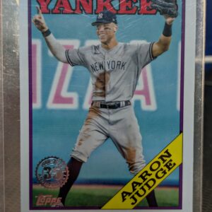 Authentic 2023 Topps Aaron Judge vintage baseball trading card displaying the classic 1988 35th anniversary design safely protected inside a clear plastic sleeve for premium collectors.